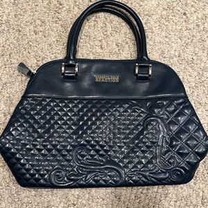 Navy Blue. Kenneth Cole. Never been used. Plastic protection still on zipper.